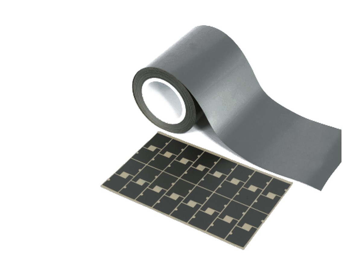 EMI absorber sheet in roll format with die-cut pieces
